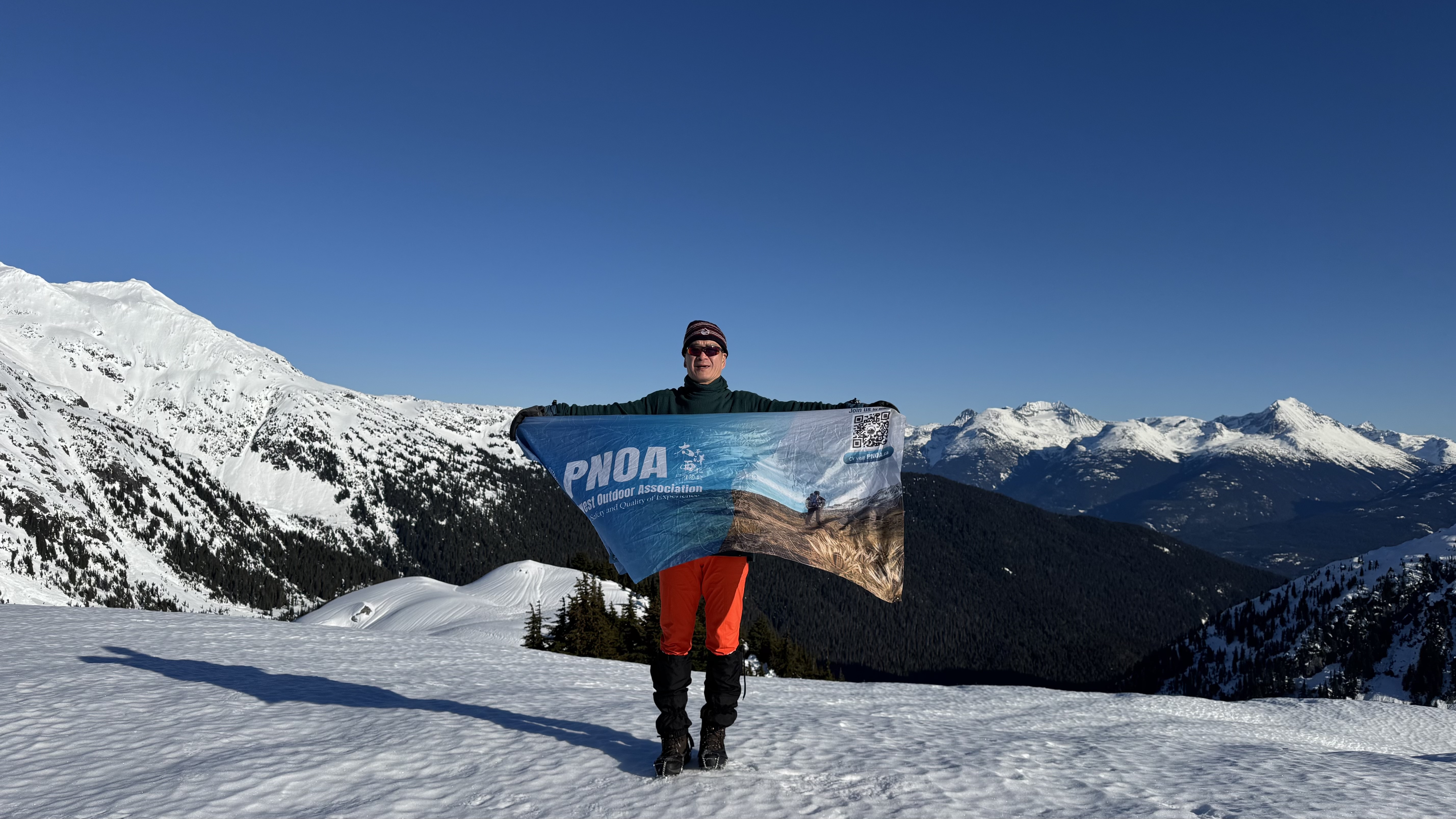 Patrick Ni standing at Gin Peak summit
